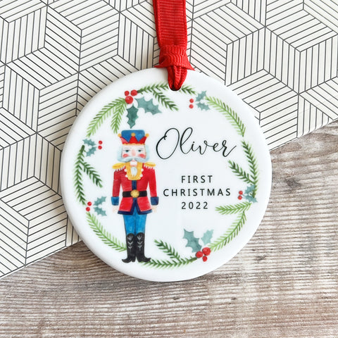 Personalised Baby’s First Christmas New Baby Boy Girl Newborn Nutcracker theme Holly Wreath Greenery Ceramic Round Decoration