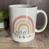 Personalised The greater the storm ... pastel rainbow Mug
